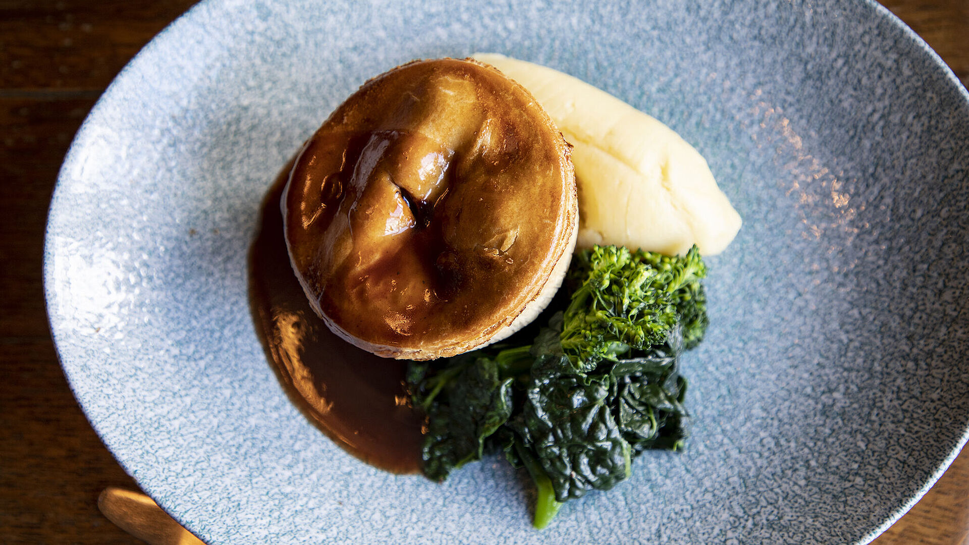 Pie and vegetables with a pint of 6X