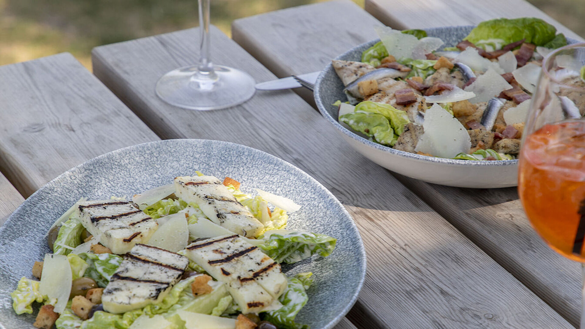 Halloumi Caesar salad with a glass of wine